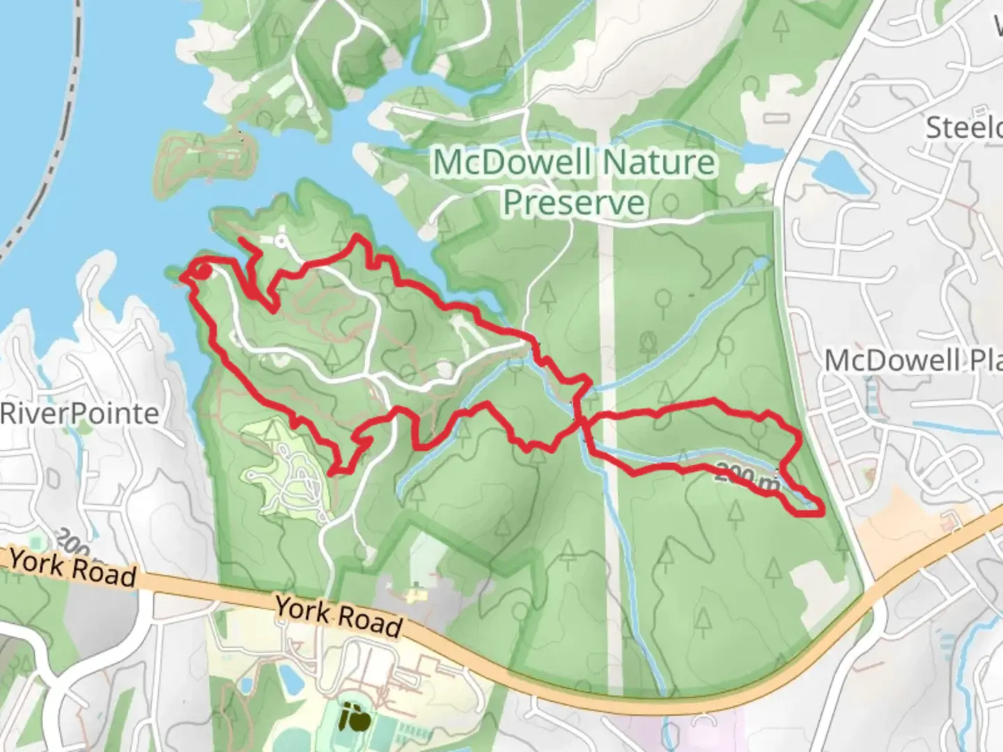 An image depicting the trail Kingfisher - Cove - Creekside - Pine Hollow Loop Trail and its surrounding area.