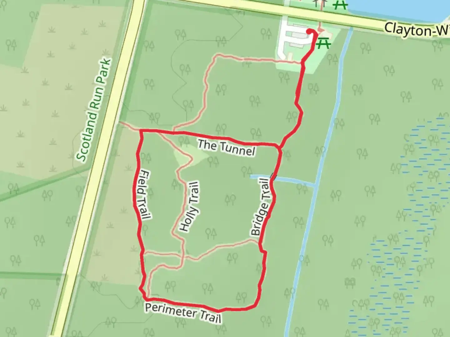 An image depicting the trail The Tunnel, Field and Bridge Loop Trail and its surrounding area.