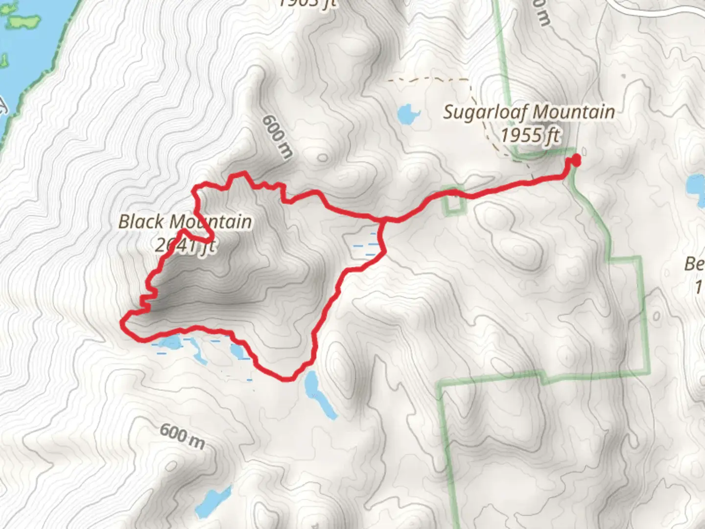 An image depicting the trail Black Mountain via Black Mountain Ponds Trail and its surrounding area.
