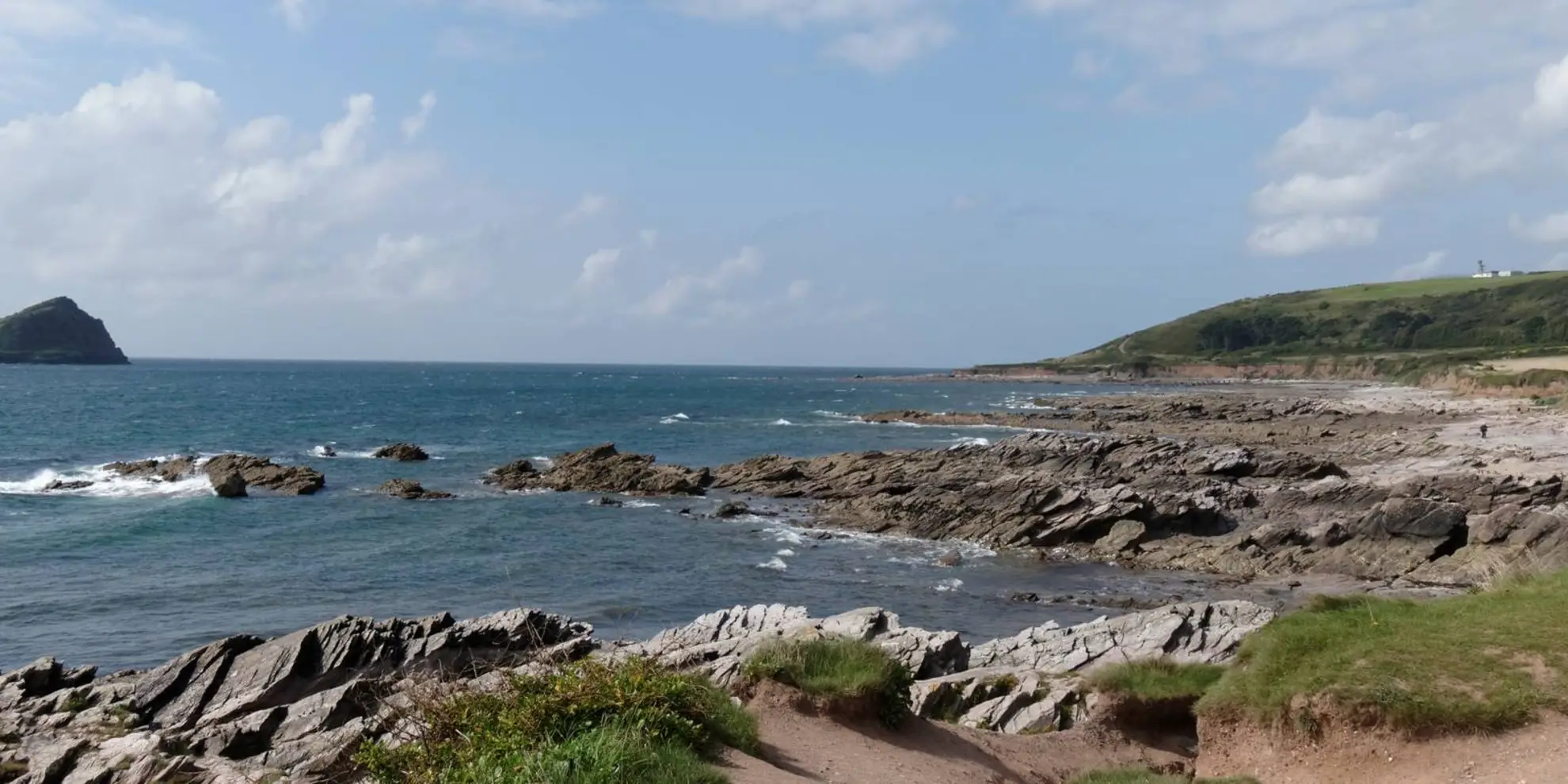 An image depicting the trail Wembury Bay and St Peter's Church from Noss Mayo and its surrounding area.