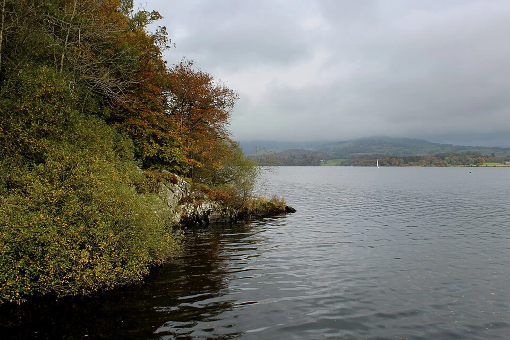 An image depicting the trail High Wray and Windermere Shore Loop - Wray Castle and its surrounding area.