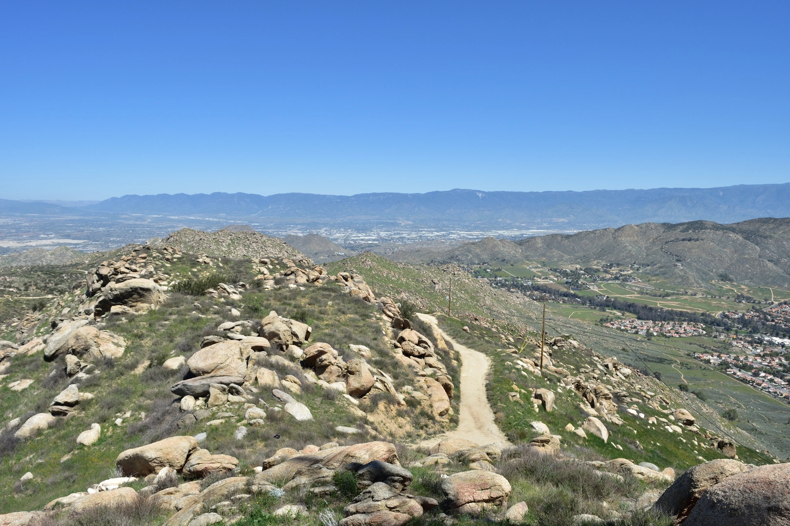 An image depicting the trail Box Springs Mountain Road and its surrounding area.