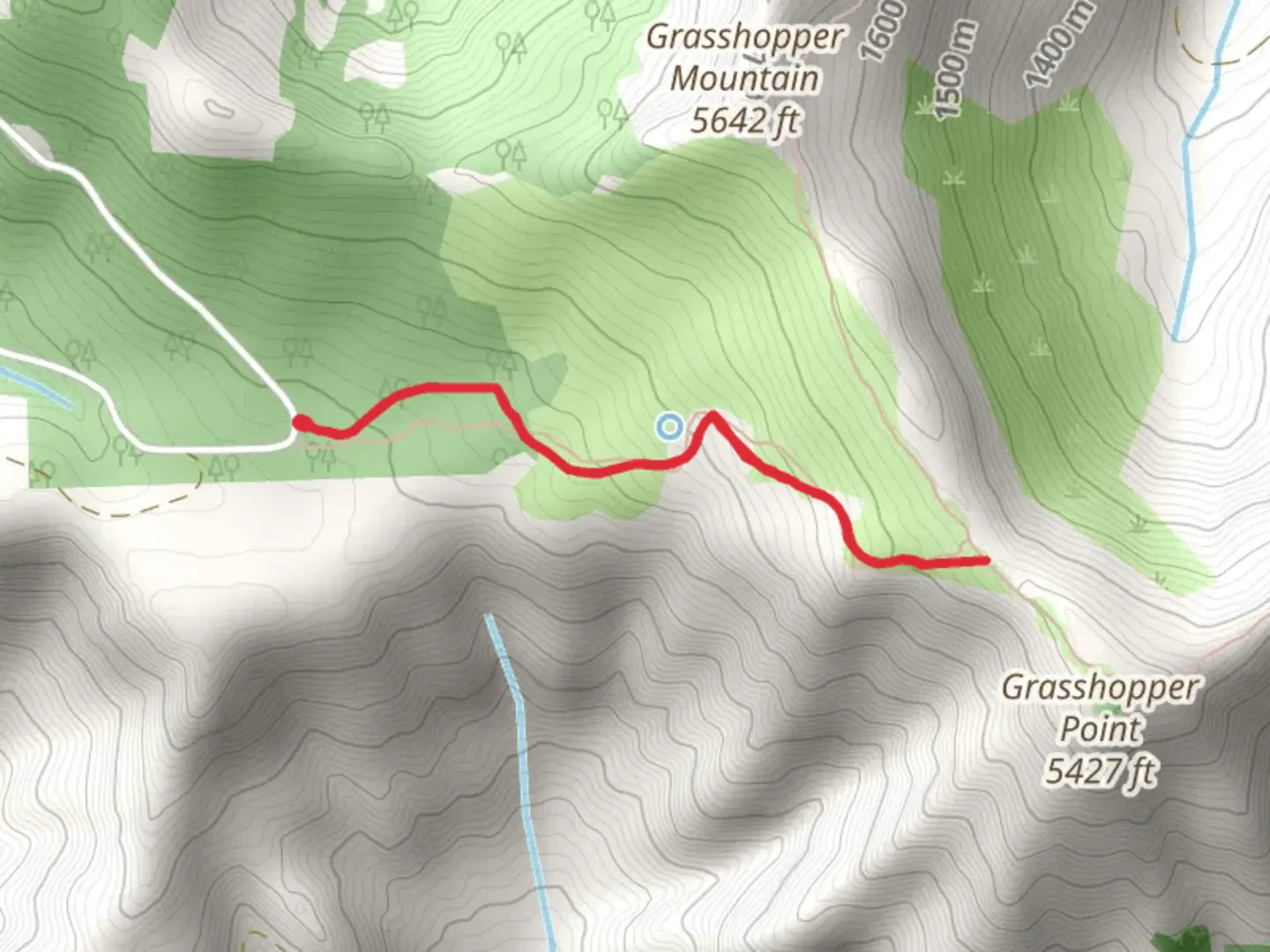 An image depicting the trail Grasshopper Meadow Trail and its surrounding area.