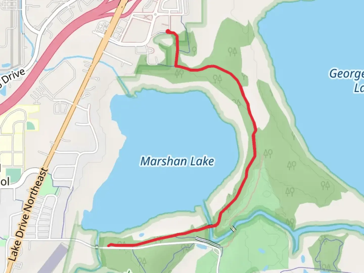 An image depicting the trail Marshan Lake East Shore Trail and its surrounding area.