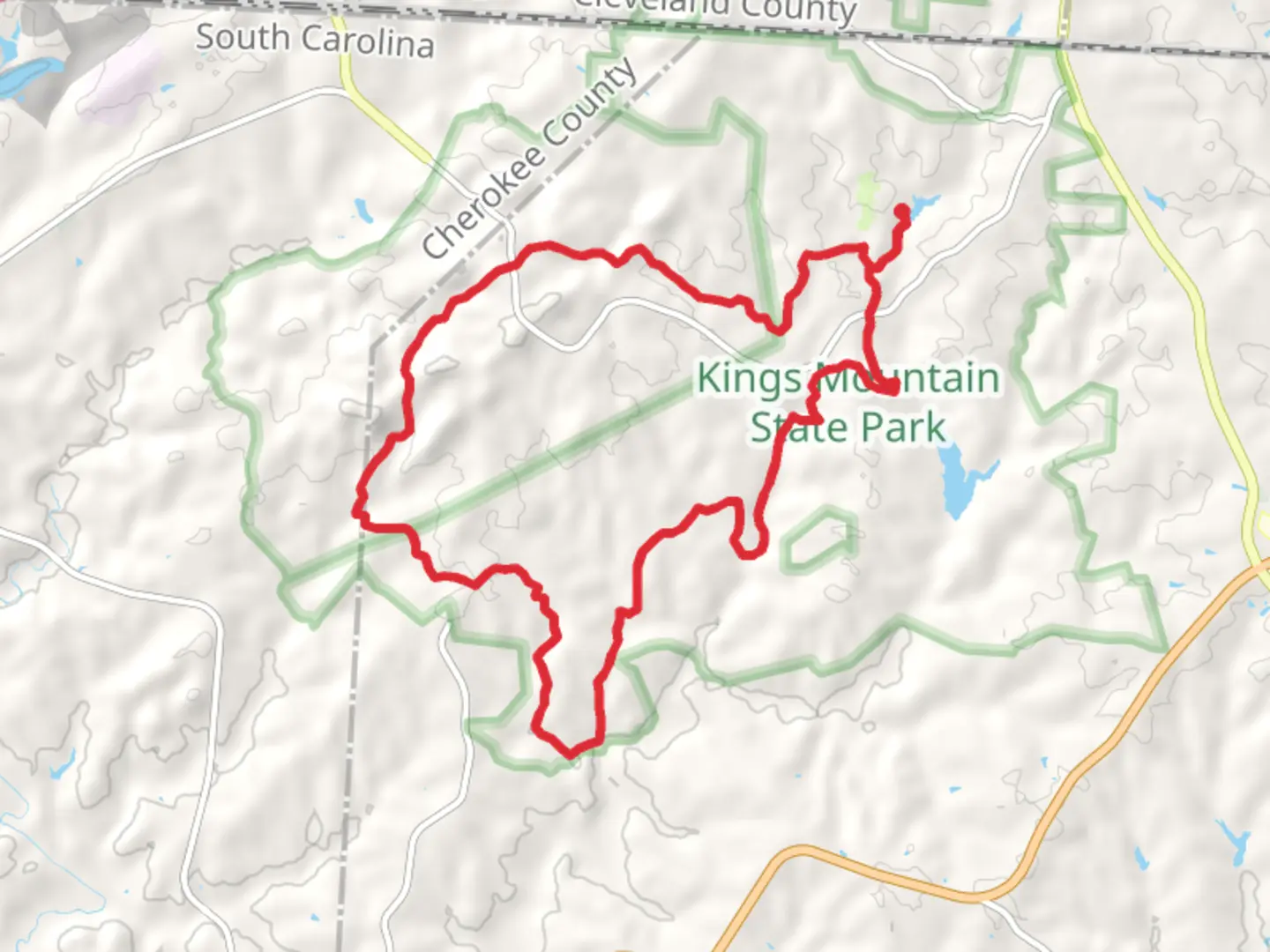 An image depicting the trail Kings Mountain National Recreation Loop Trail from Lake Crawford and its surrounding area.