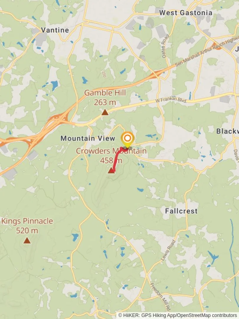An image depicting the trail Crowders Mountain and its surrounding area.