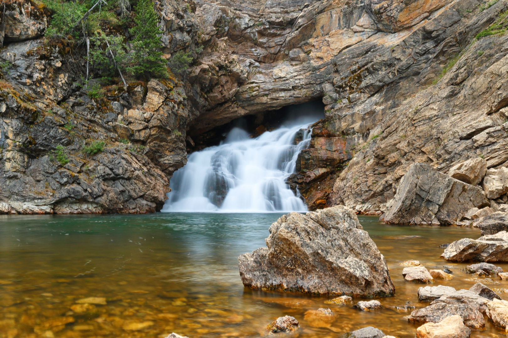 An image depicting the trail Running Eagle Falls Trail and its surrounding area.