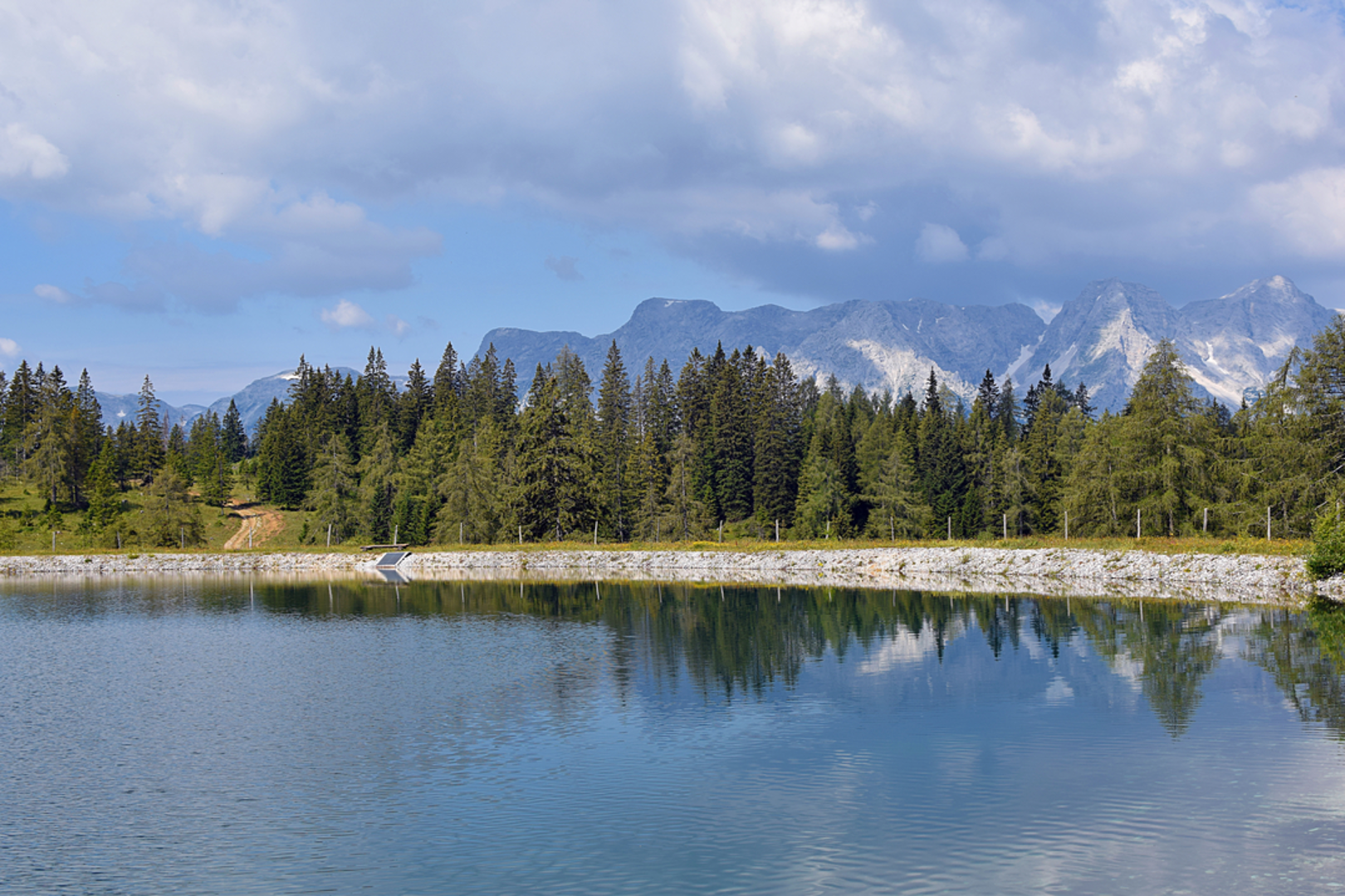 An image depicting the trail Hutterer Alpine Meadows Loop Trail and its surrounding area.