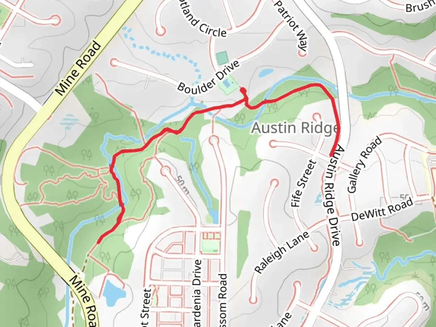 An image depicting the trail Rocky Run Trail in Robertson Towson Park and its surrounding area.