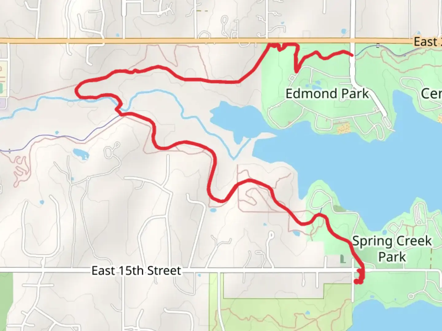 An image depicting the trail Spring Creek, Edmond Park and Lake Arcadia and its surrounding area.