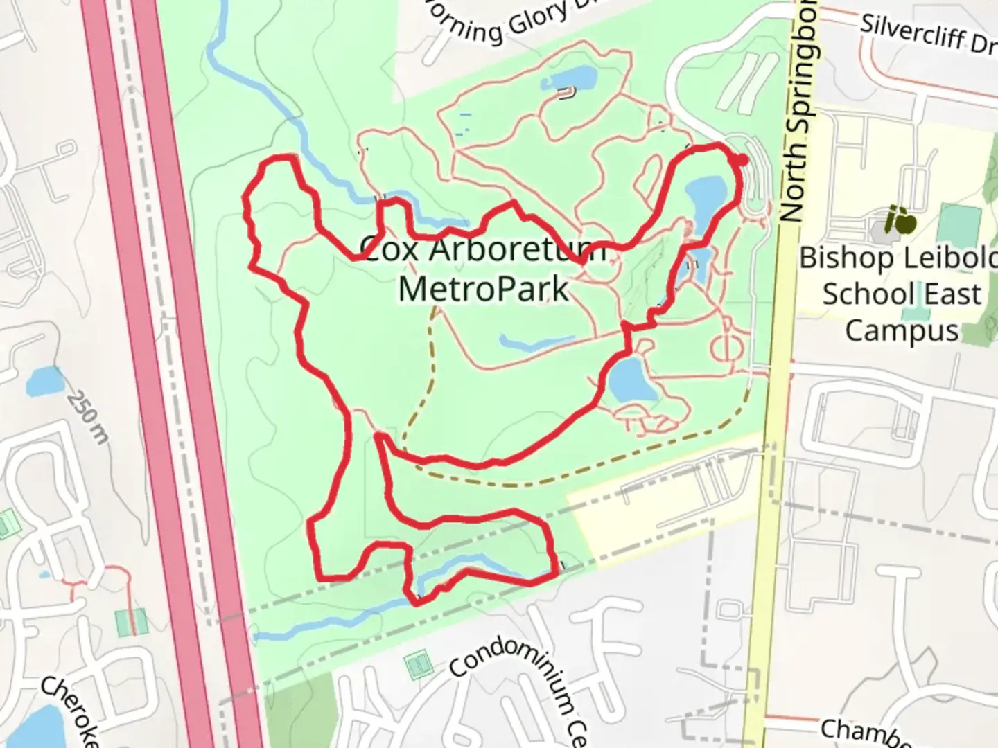 An image depicting the trail Blue and Yellow Loop Trail - Cox Arboretum MetroPark and its surrounding area.
