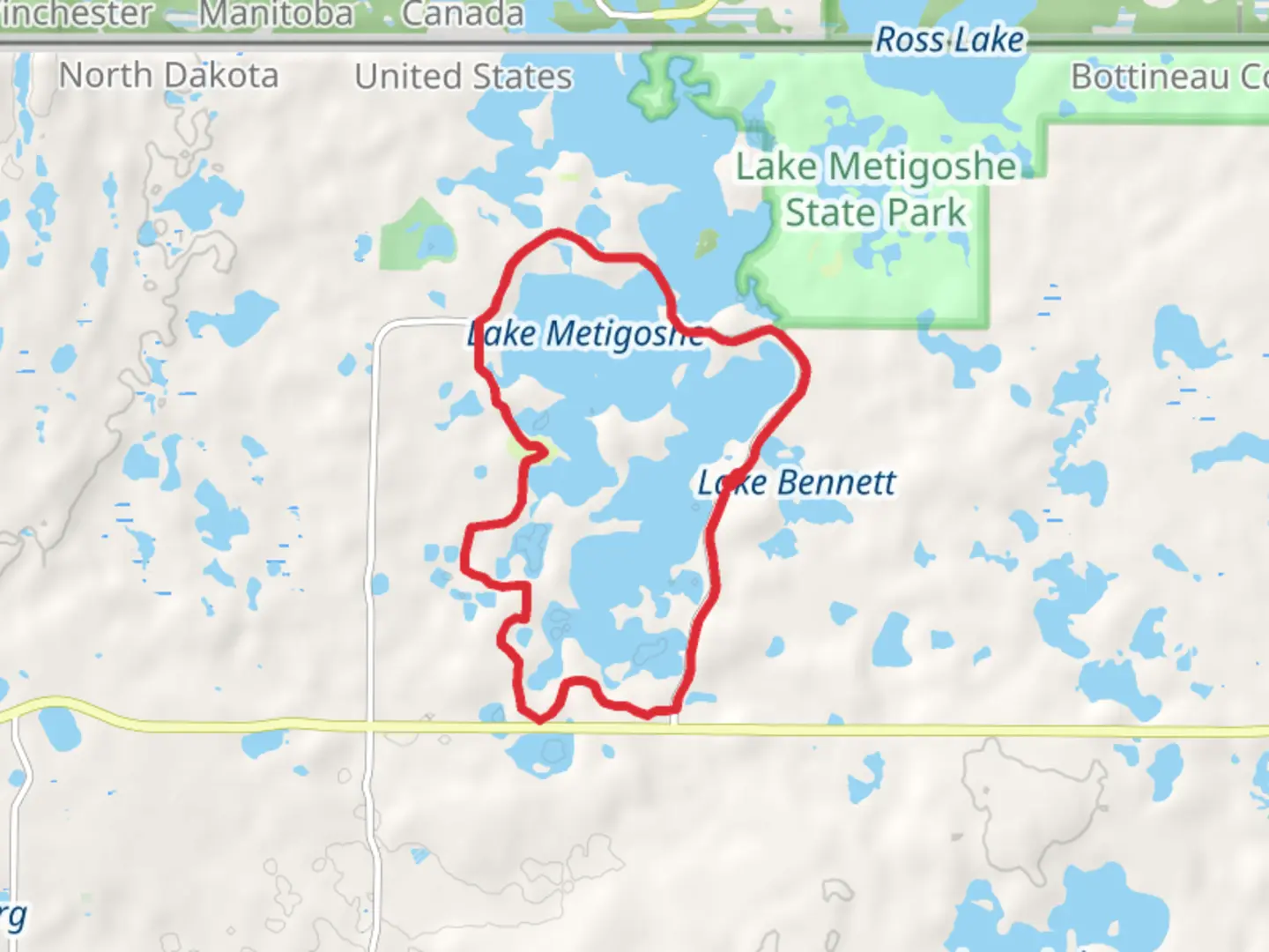 An image depicting the trail Lake Metigoshe Loop Path and its surrounding area.