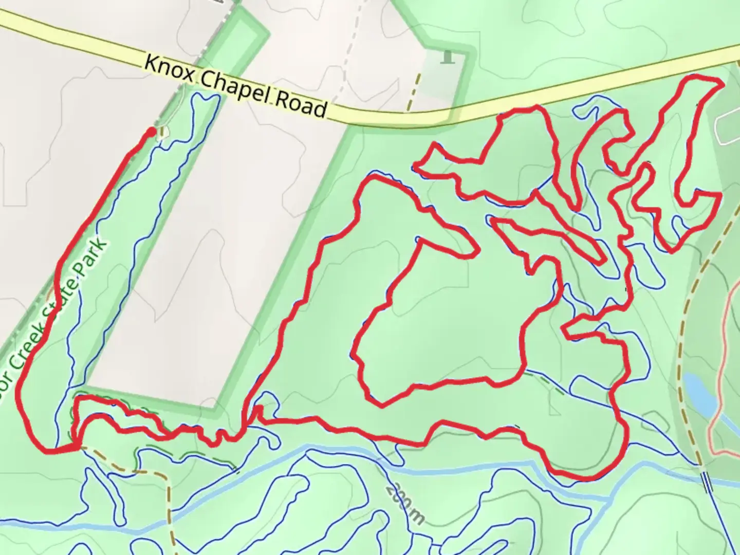 An image depicting the trail Rocky Creek - Red Loop and its surrounding area.