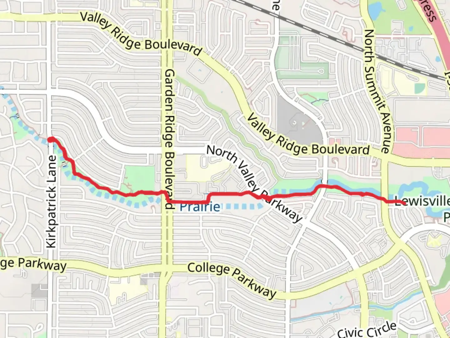 An image depicting the trail Lewisville Greenbelt Park and its surrounding area.