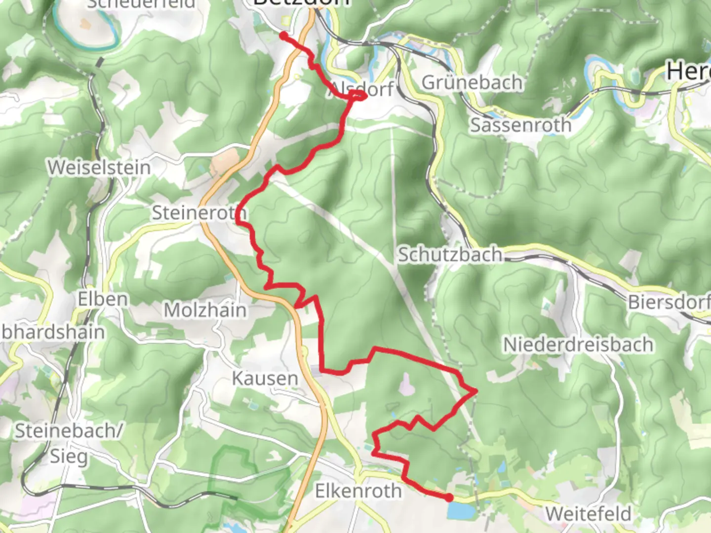 An image depicting the trail Elkenrother Weiher to Betzdorf via Druidensteig and its surrounding area.