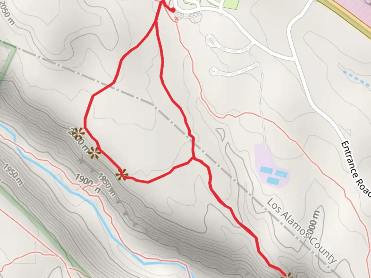 An image depicting the trail Tyuonyi Overlook Trail and its surrounding area.