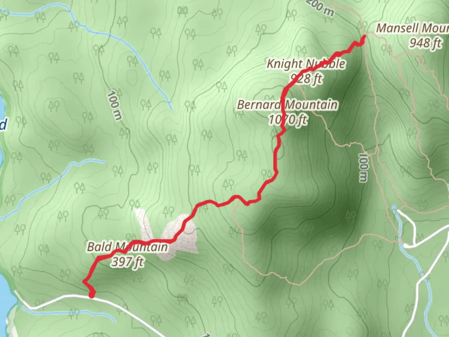An image depicting the trail Bald Mountain and Knight Nubble from Seal Cove Pond Road and its surrounding area.