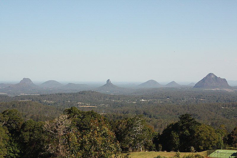 An image depicting the trail Glass House Mountains National Park and its surrounding area.