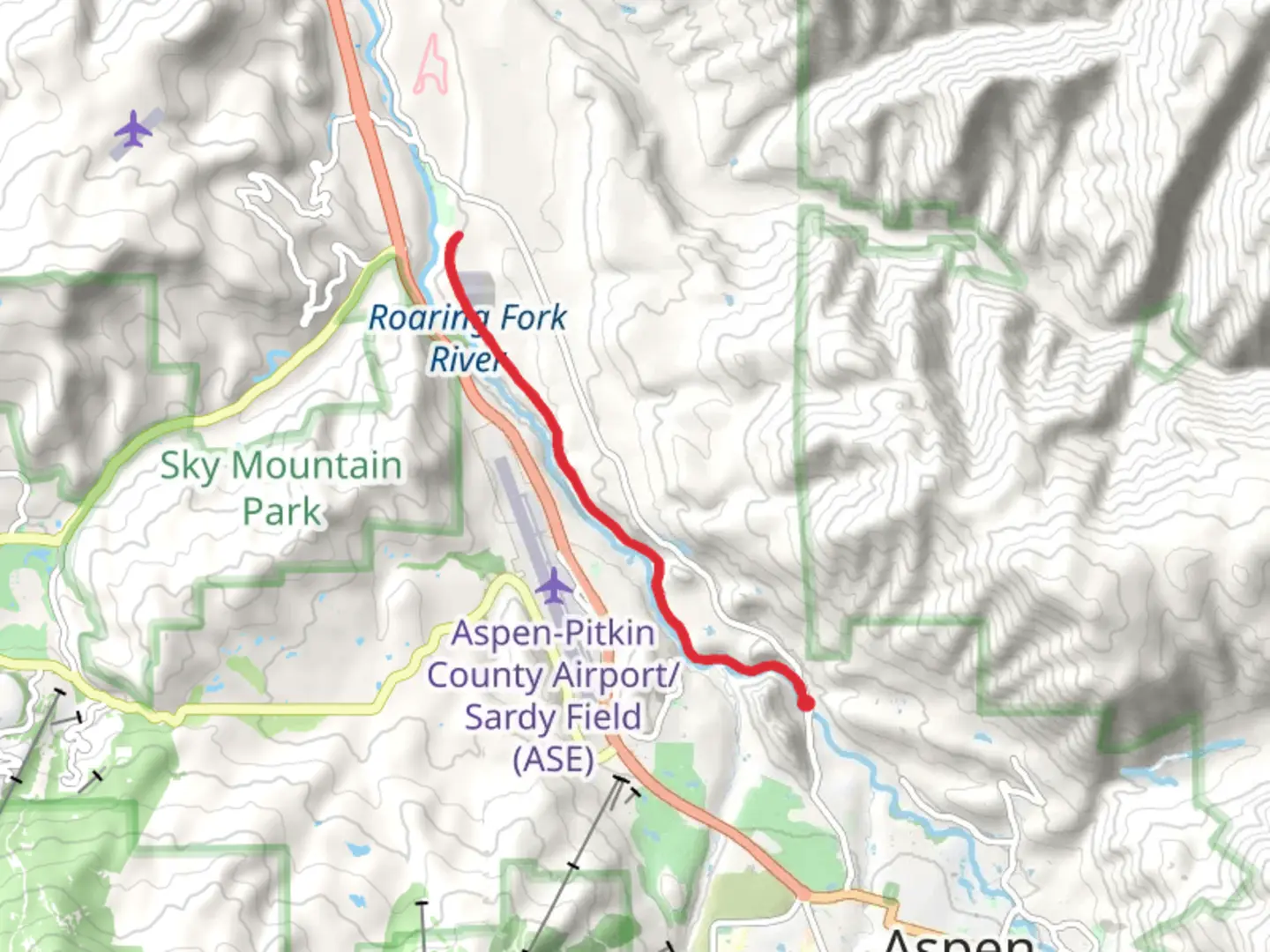 An image depicting the trail Rio Grande Trail along Roaring Fork River and its surrounding area.