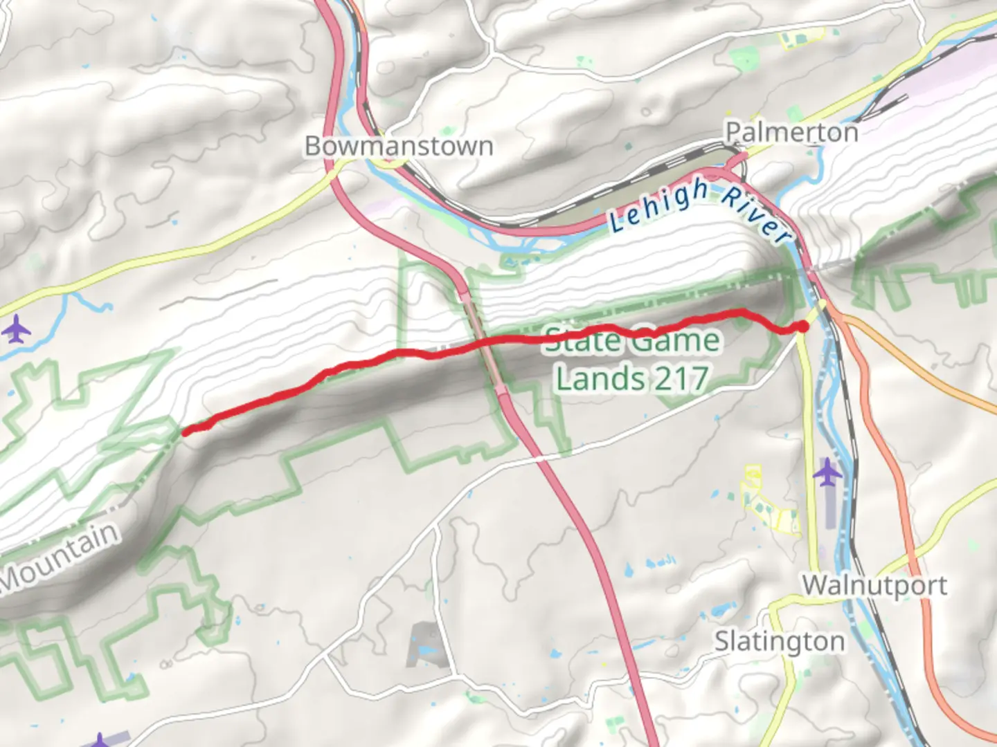 An image depicting the trail Woodpecker Trail and its surrounding area.
