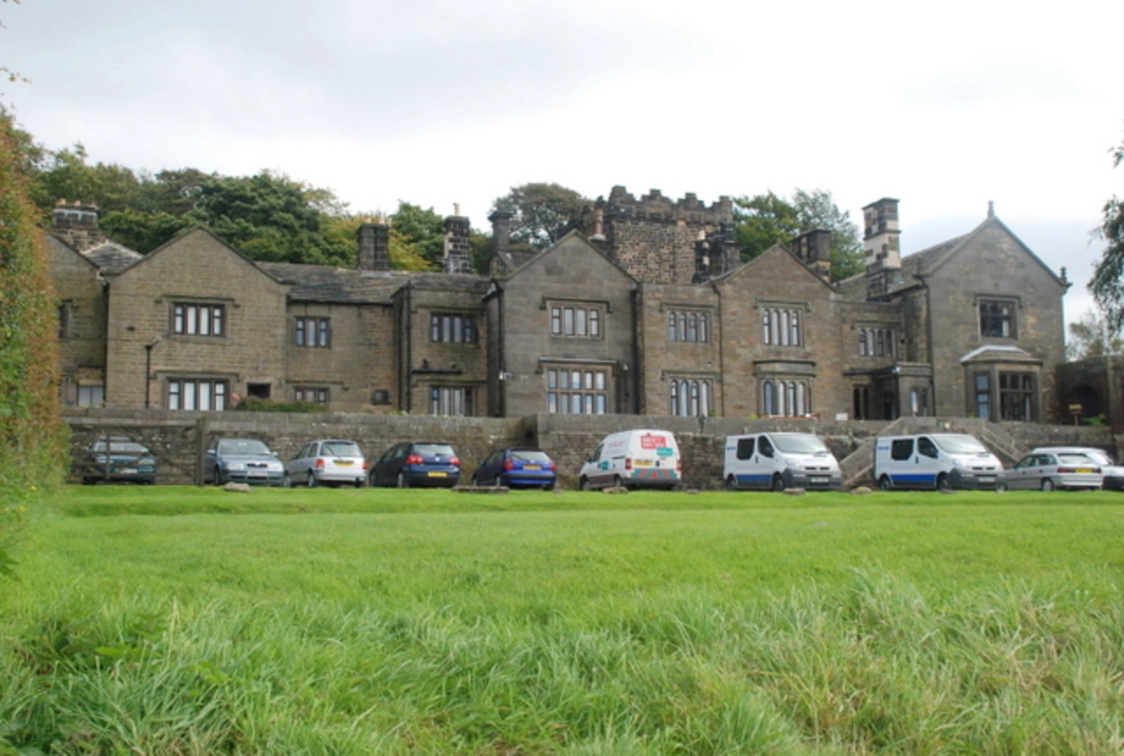 An image depicting the trail Longshaw Walk and its surrounding area.