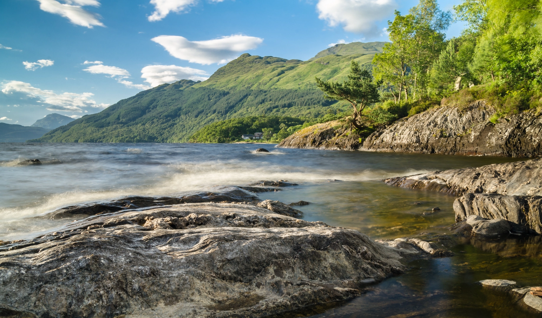 An image depicting the trail Ben Lomond from Loch Lomond and its surrounding area.
