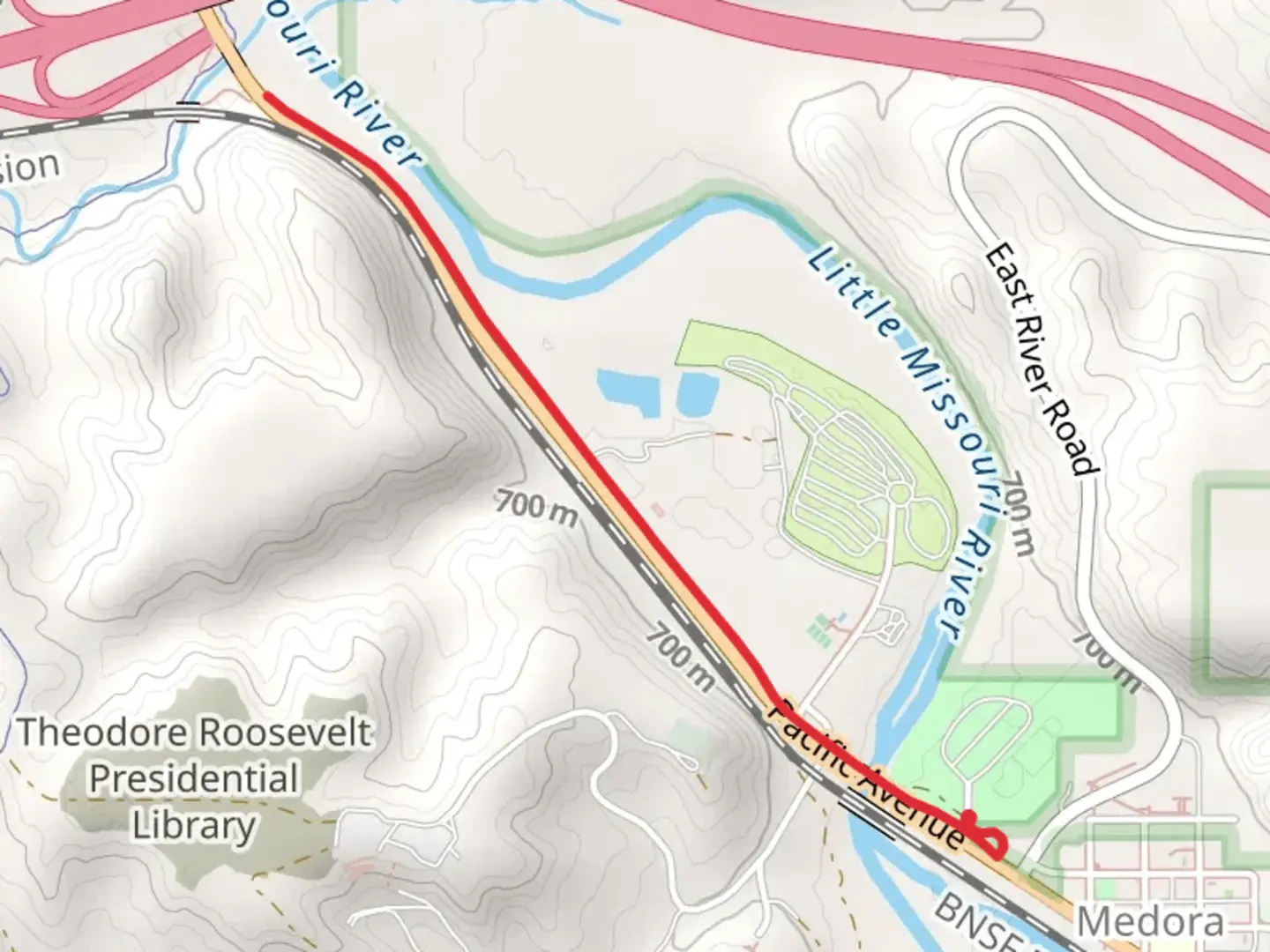 An image depicting the trail Little Missouri River Walk and its surrounding area.