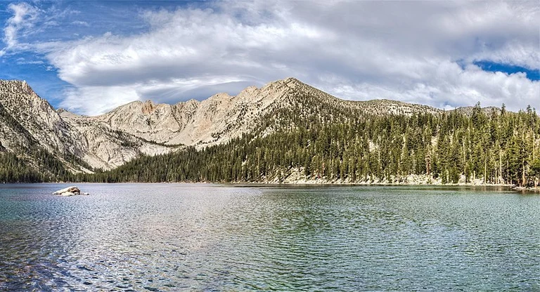 An image depicting the trail Wilbur May Lake via Goodale Pass Trail and its surrounding area.