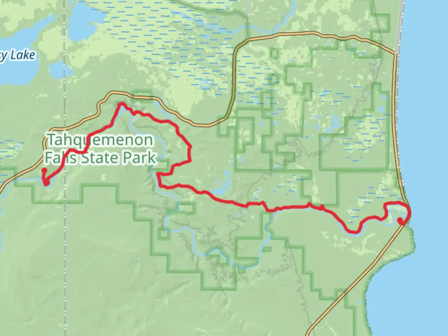 An image depicting the trail Tahquamenon River via NCT and its surrounding area.