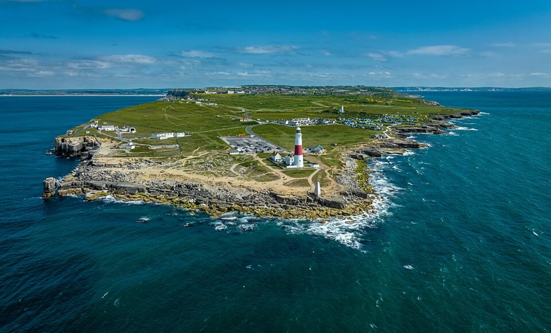 An image depicting the trail Portland Bill Lighthouse and SW Coastal Path Viewing Point and its surrounding area.