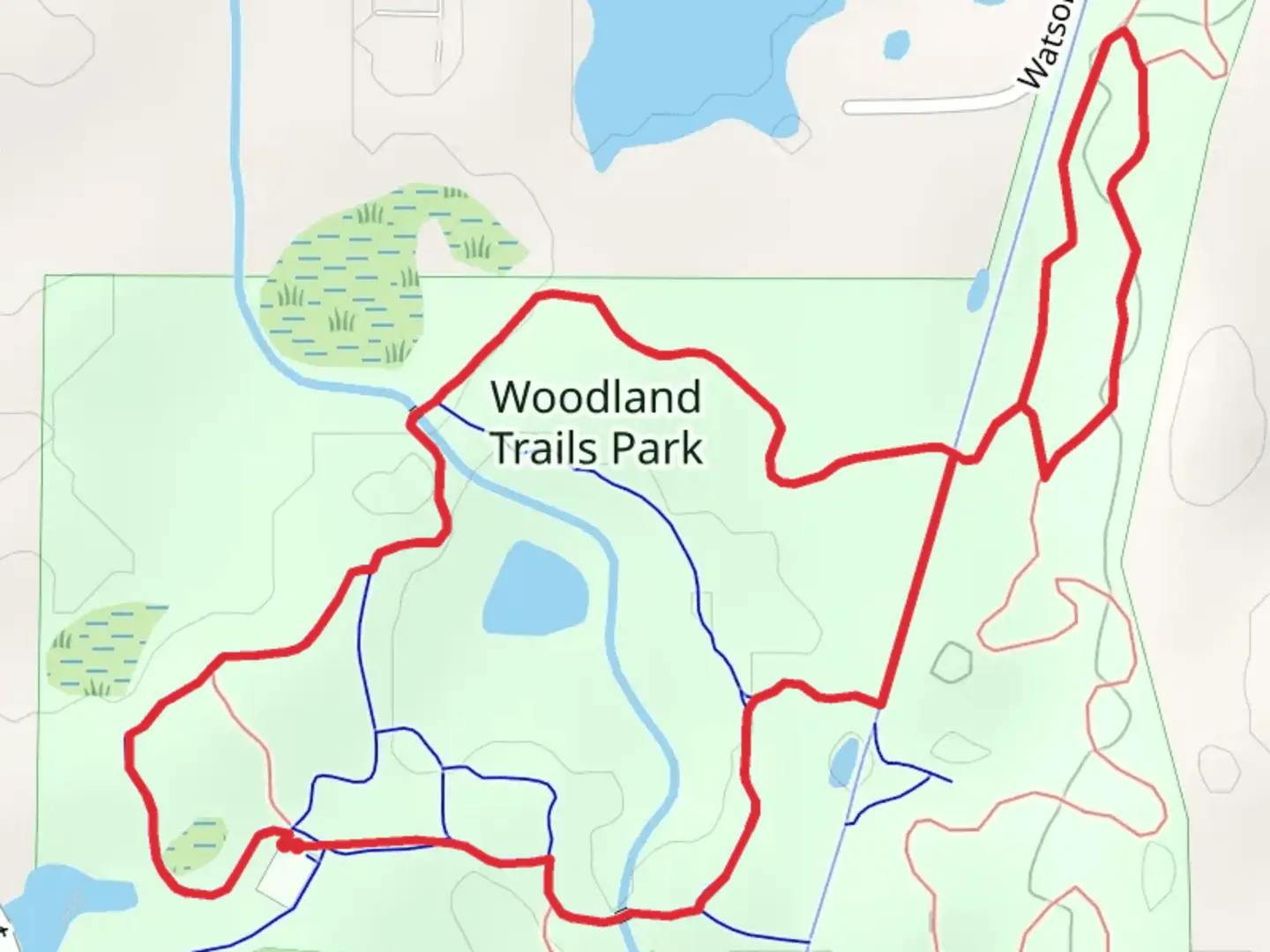 An image depicting the trail Woodland Park Loop Trail and its surrounding area.