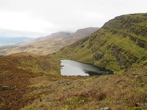 An image depicting the trail Knockanaffrin South Top and its surrounding area.