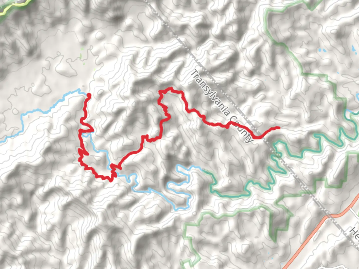 An image depicting the trail Squirrel Gap Trail via South Mills River Road and its surrounding area.