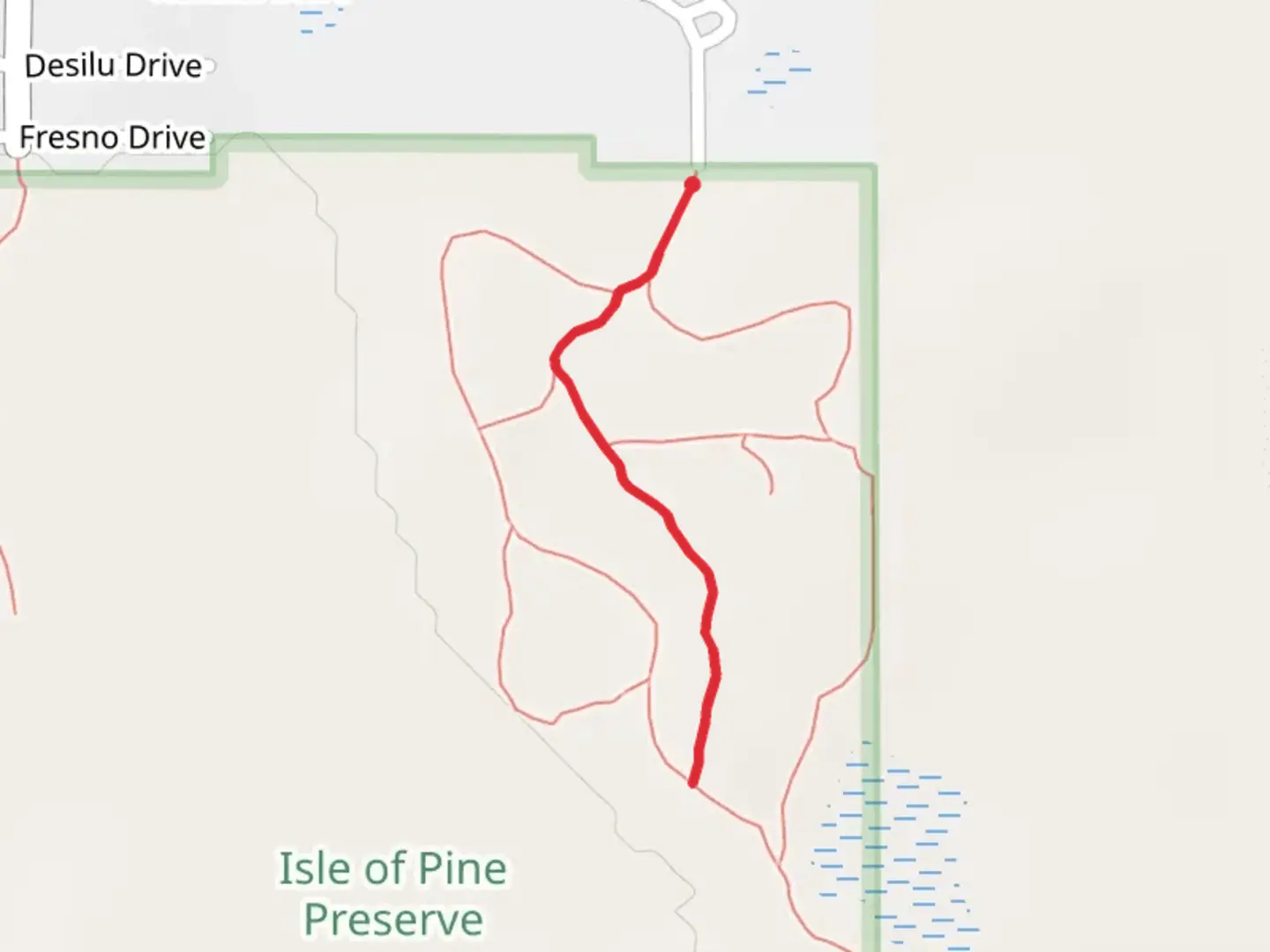 An image depicting the trail Isle of Pine Red Trail and its surrounding area.