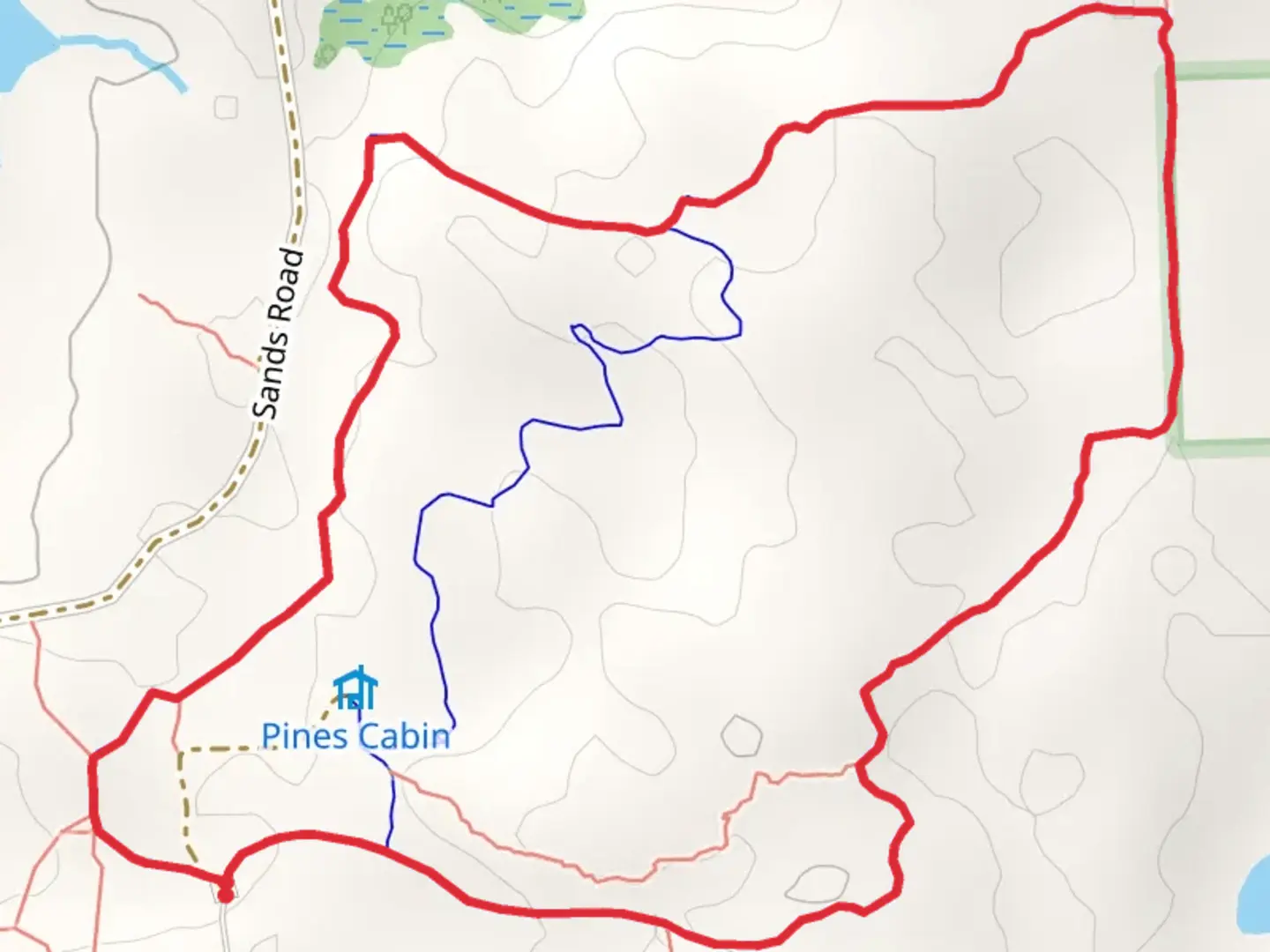 An image depicting the trail Ortonville Recreation Areal Bloomer Loop Trail and its surrounding area.