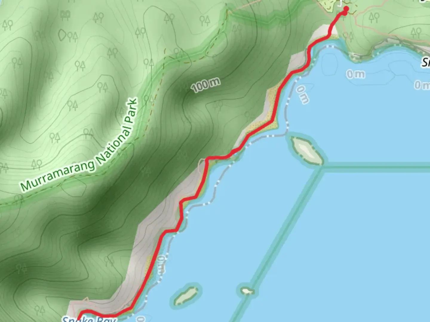 An image depicting the trail Pretty Beach to Snake Bay Track and its surrounding area.