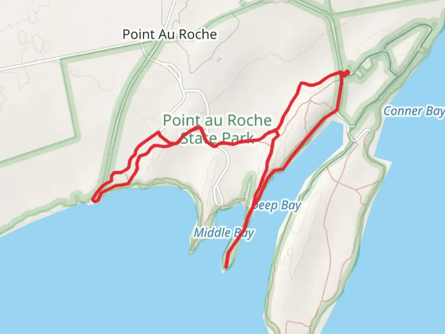 An image depicting the trail Point Au Roche State Park and its surrounding area.