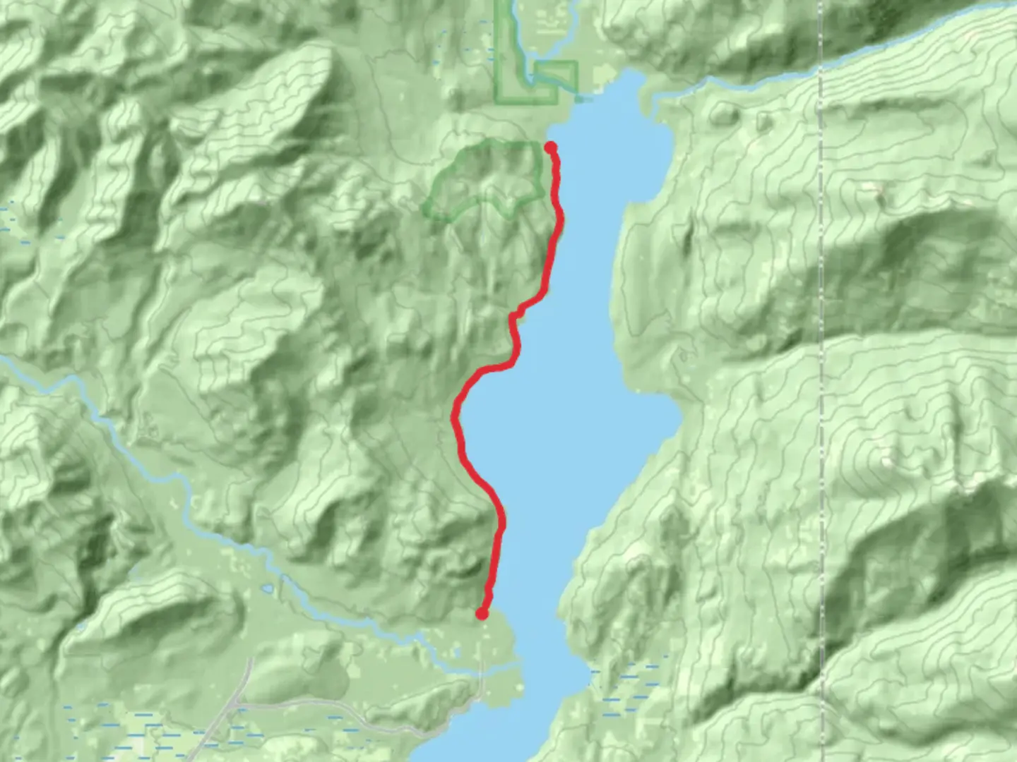 An image depicting the trail Lakeshore to Tripod Point - Priest Lake and its surrounding area.