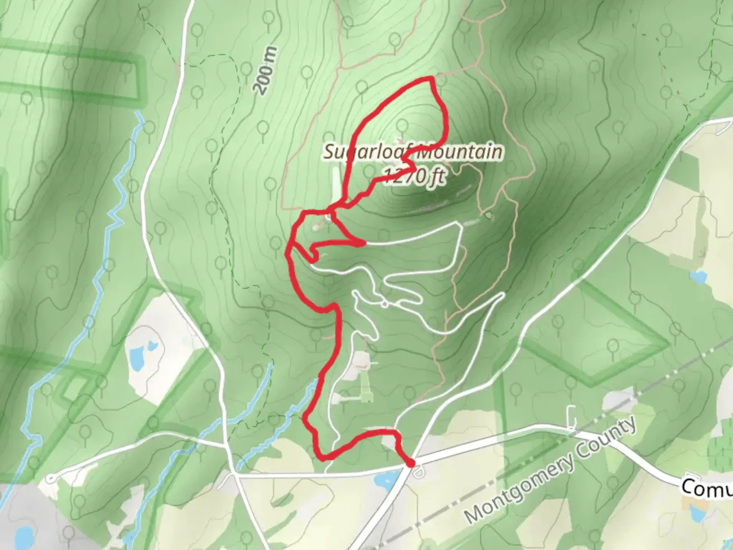 An image depicting the trail Northern Peaks Blue and The Monadnock Red Loop Trail and its surrounding area.
