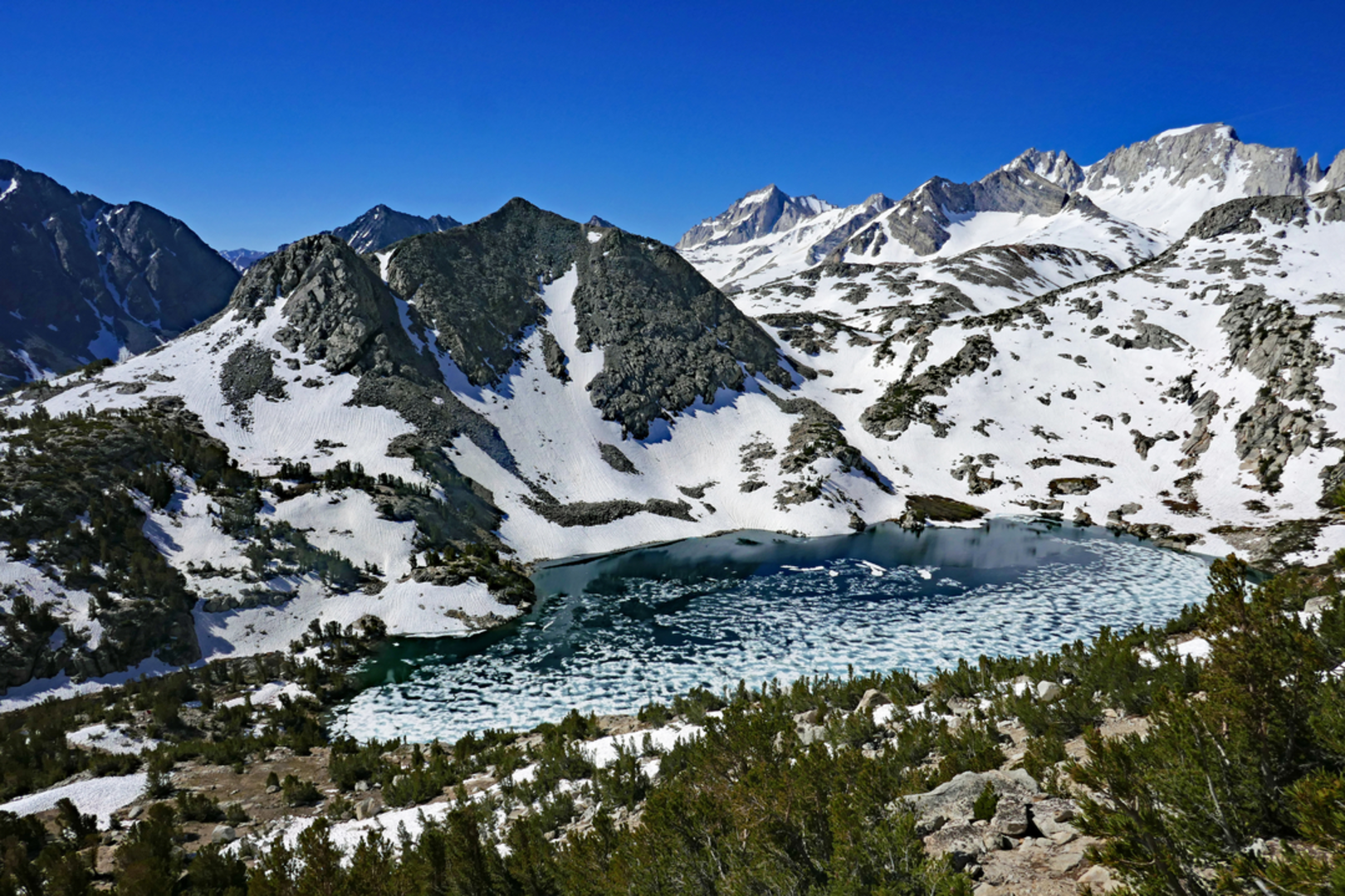 An image depicting the trail Chickenfoot Lake via Little Lakes Valley Trail and its surrounding area.
