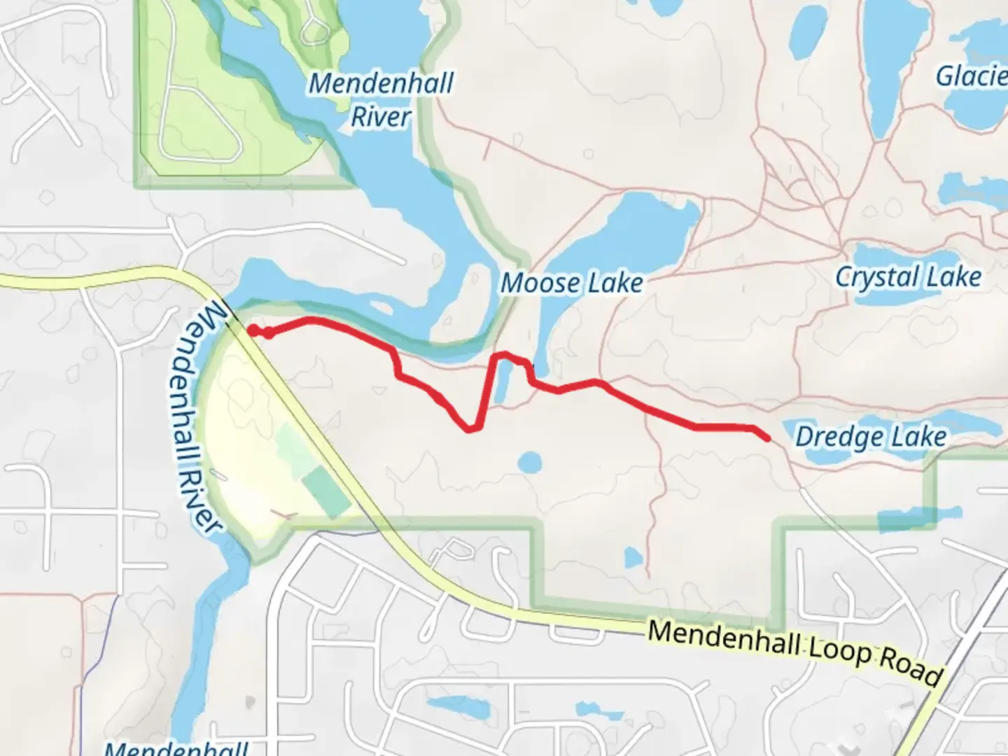An image depicting the trail Back Loop Bridge and Dredge Lake Trail and its surrounding area.