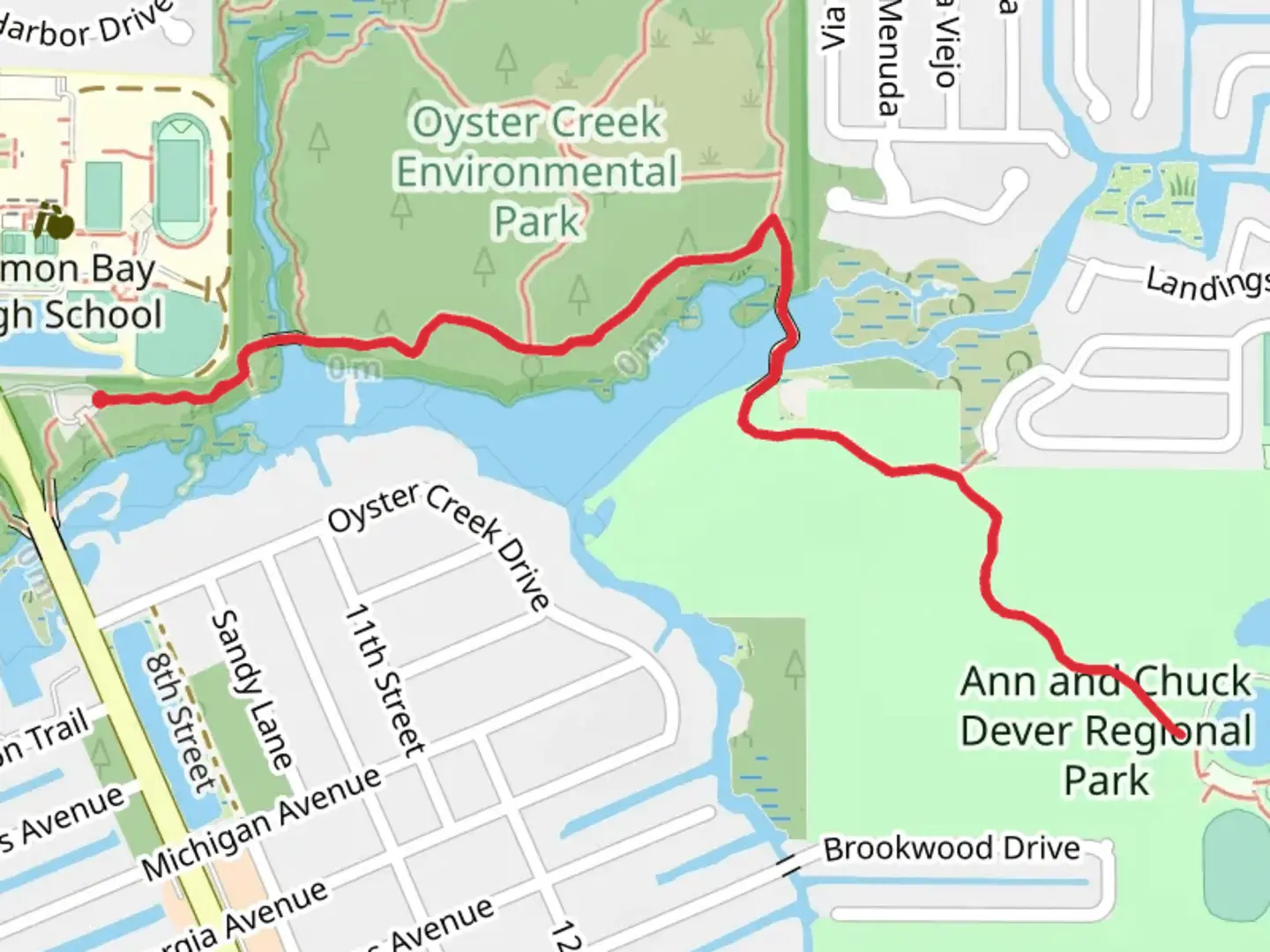An image depicting the trail Ann and Chuck Dever Regional Park via Red Trail and Green Trail and its surrounding area.