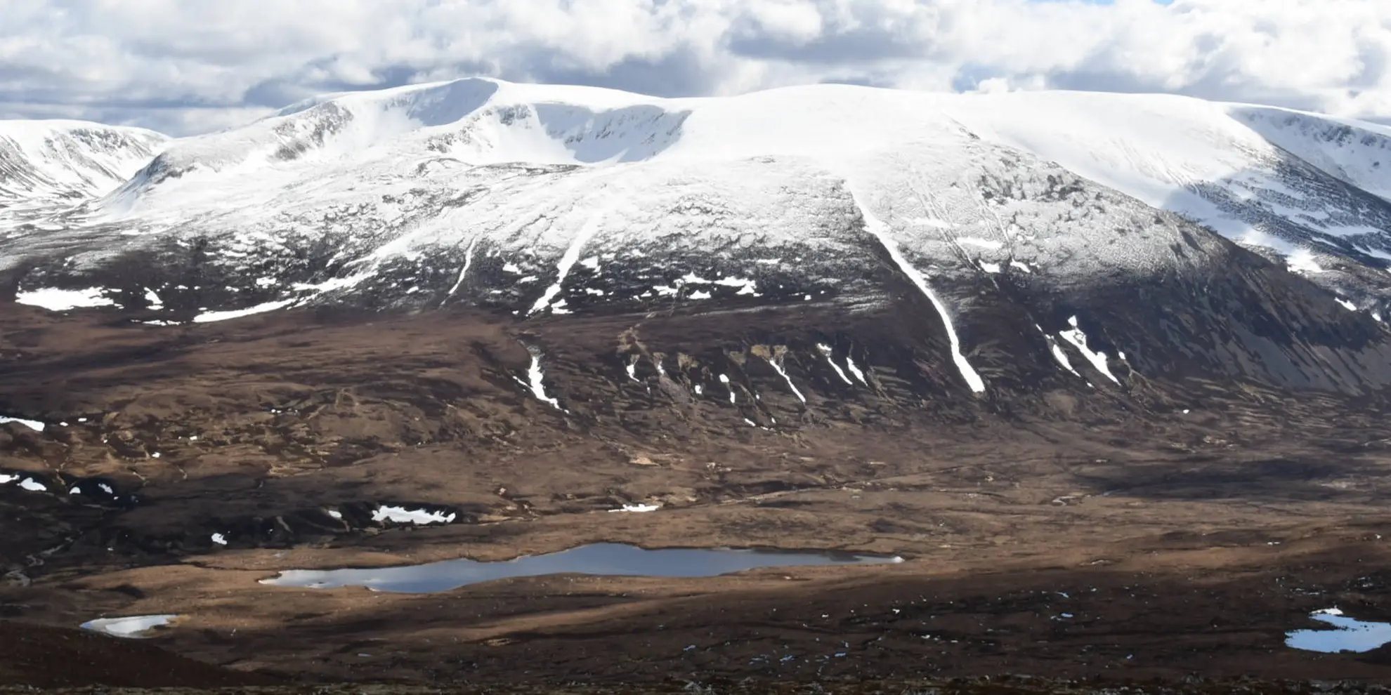 An image depicting the trail Braeriach and Loch Coire an Lochan from Loch an Eilein and its surrounding area.