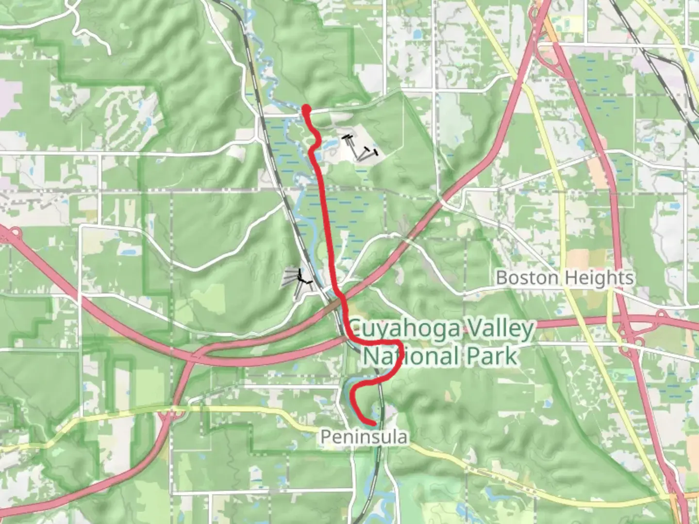 An image depicting the trail Ohio and Erie Canal Towpath Trail along Cuyahoga River and its surrounding area.