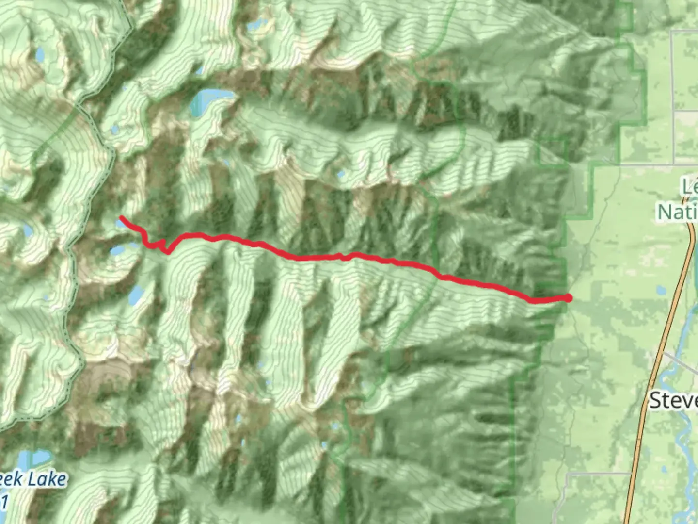 An image depicting the trail Kootenai Creek Trail and its surrounding area.