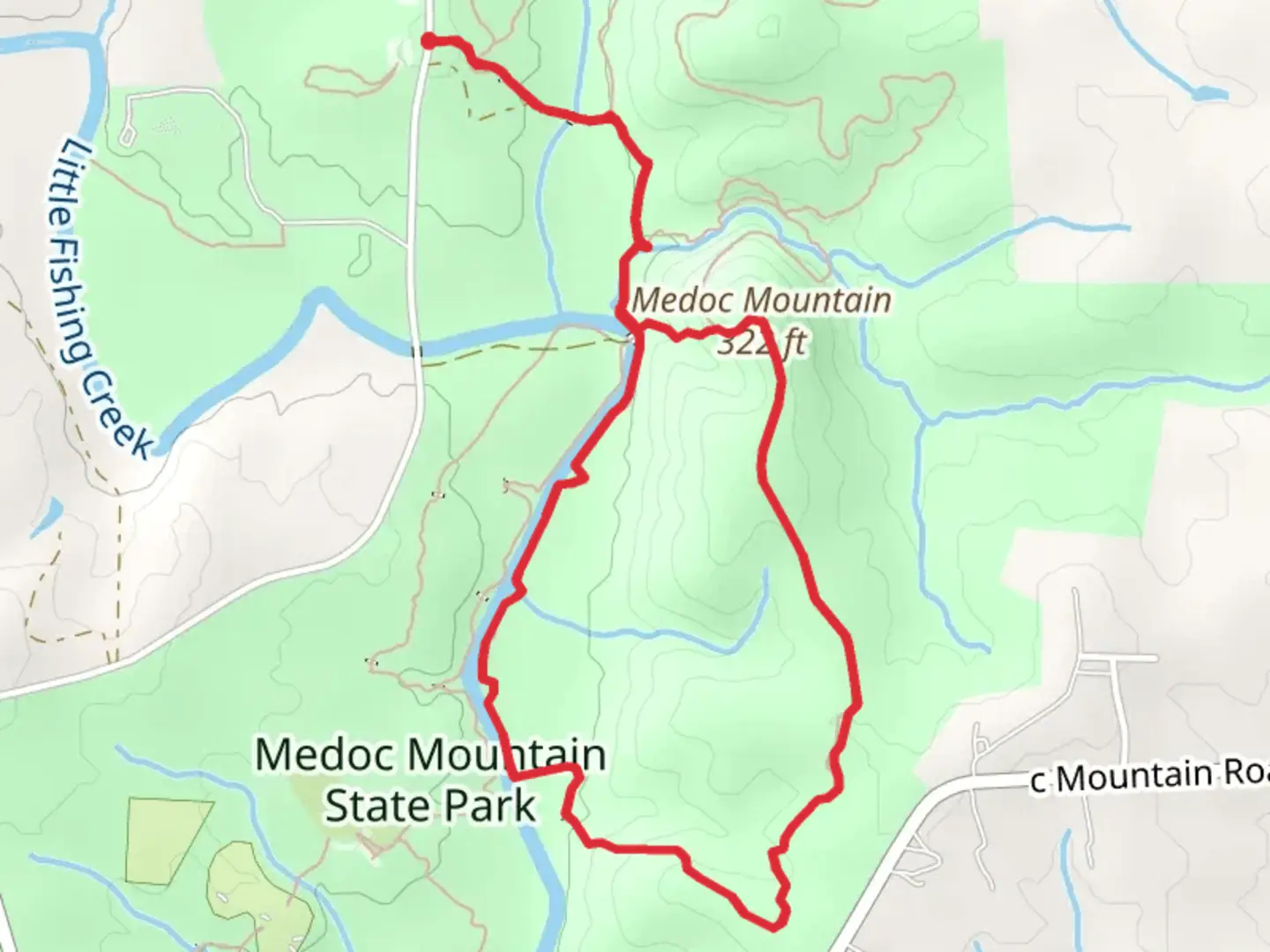 An image depicting the trail Medoc Mountain - Summit Loop Trail and its surrounding area.