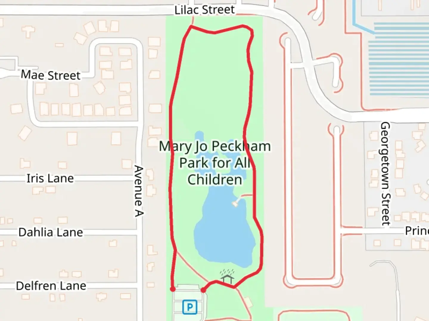 An image depicting the trail Mary Jo Peckham Park for All Children Loop and its surrounding area.