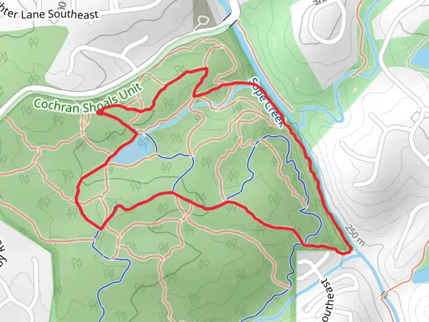 An image depicting the trail Sope Creek Loop from Paper Mill Road Southeast and its surrounding area.