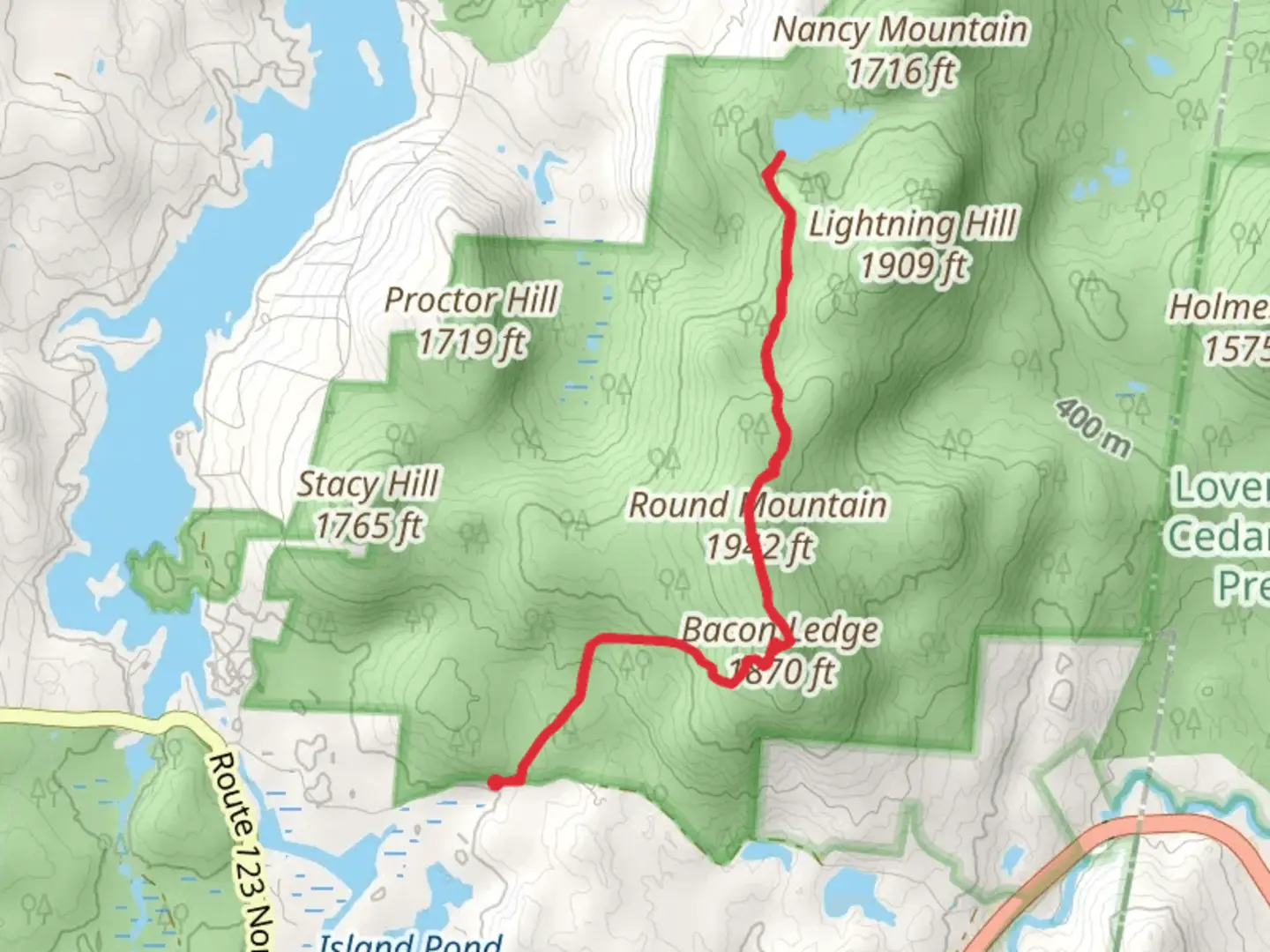 An image depicting the trail Trout Pond via Round Mountain and Bacon Ledge Trail and its surrounding area.