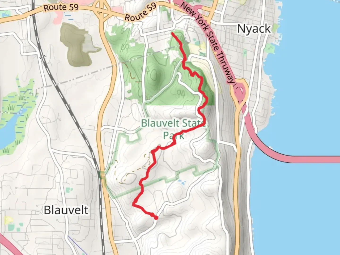 An image depicting the trail Long Path Green Trail via Clausland Mountain Road and its surrounding area.